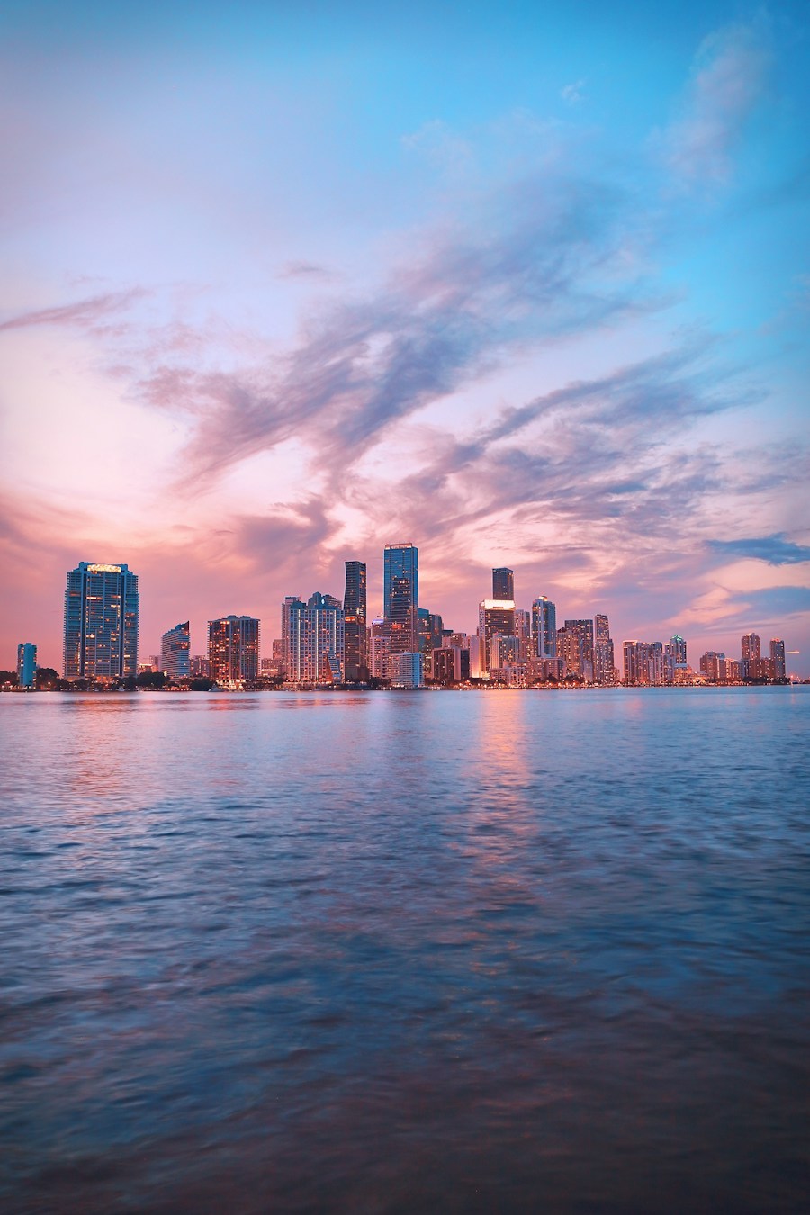 Miami skyline at dusk across the water